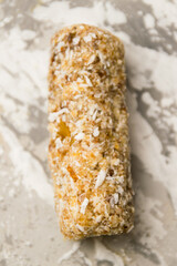 Delicious homemade energy bar without sugar on light background. Diet and healthy eating concept