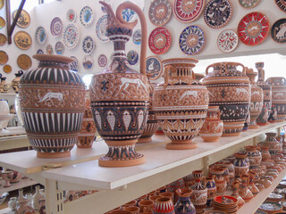 Colorful pottery displayed in a traditional market