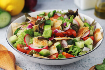 A bowl with Fattoush - Traditional Levantine salad