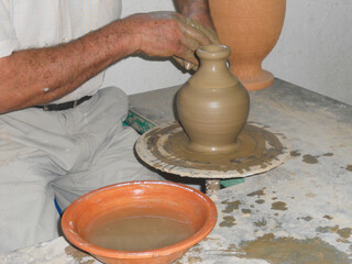 Crafting a clay vase on a pottery wheel