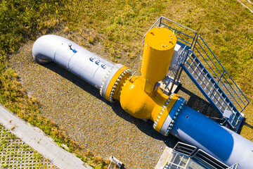Natural gas pipeline in European Union. High pressure pipes on a hot summer day.