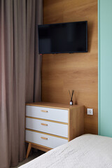 Contemporary Modern Bedroom Complete with a WallMounted TV and Stylish, Chic Furniture