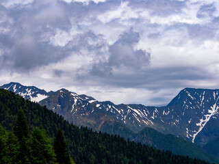 Close-up of mountain peaks adorned with snow caps, reflecting the power and beauty of the wild