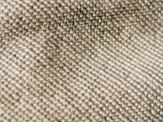 Macro photography of fabric texture, detailing soft waves and patterns, creating an impression of tactile comfort and artistic elegance