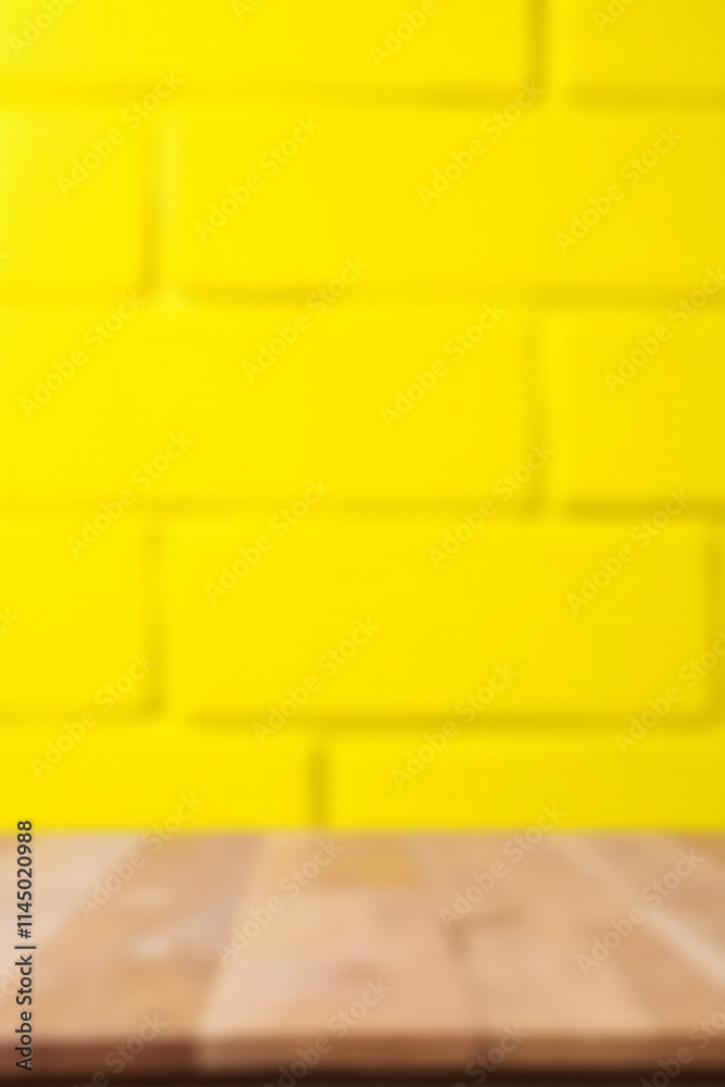 Poster a selective focus on an empty wooden table top against a bright yellow brick wall background is crea