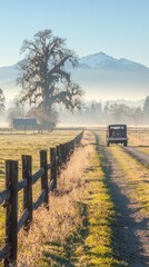 Obraz premium A serene landscape with a dirt road, vintage car, and mountains in the background.