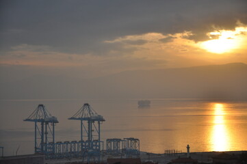 Rijeka city new crains for harbour and containers. Modern Crain that moves with to remote. Most modern Crain in Europe. Sunset over Rijeka harbour. Croatia