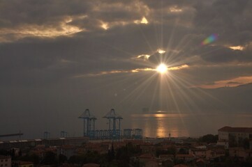 Rijeka city new crains for harbour and containers. Modern Crain that moves with to remote. Most modern Crain in Europe. Sunset over Rijeka harbour. Croatia