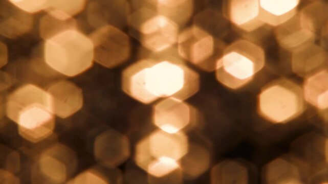 Glitter sequins light leak overlay in golden orange, glowing bright sparkling stardust particles