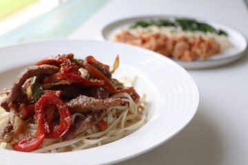 Photography of homemade plated meals. Ranging from rice dishes to wraps to chicken to pasta.