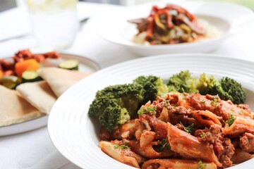 Photography of homemade plated meals. Ranging from rice dishes to wraps to chicken to pasta.