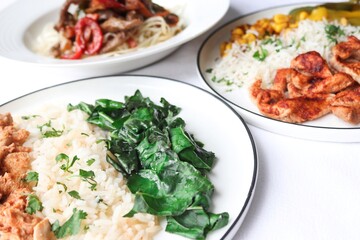 Photography of homemade plated meals. Ranging from rice dishes to wraps to chicken to pasta.