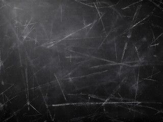 Chalkboard filled with messy chalk doodles and scribbles, evoking a classroom setting.