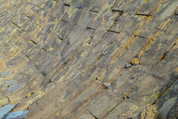 Destroyed insulated roof structures after fire and collapsing