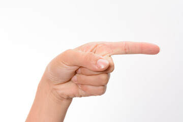 A close-up of a hand gesturing with the index finger extended, pointing towards the right side of the frame against a clean white background.