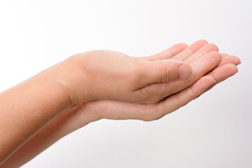 Two hands gently cupped together, palms open and slightly upward, create a sense of offering, receiving, or holding something precious against a clean white backdrop.