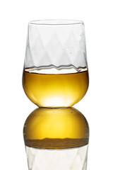 Whiskey in a glass on a white background.