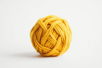 A ball of bright yellow yarn isolated on a white background.