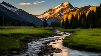 Fototapeta premium Tranquil River Through Lush Meadows With Majestic Mountain Backdrop in BC Parks
