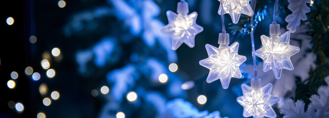 Frosted glass star lights with snowy blue winter background