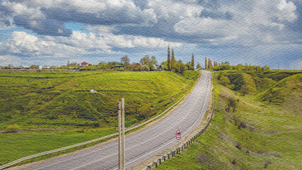 Road with a bike rider on it and a few cars in the distance