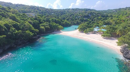 Fototapeta premium Aerial view of a serene beach with turquoise water and lush greenery.