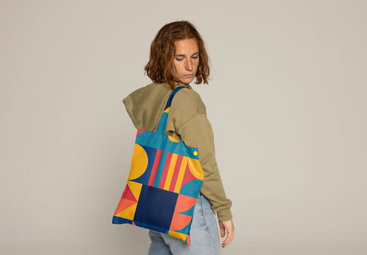 Stylish Customizable Tote Bag in a Minimalist Fashion Setting. Back view. PSD mockup. Insert your design or total print. 100% are for design (handles included)