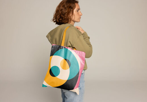 Customizable Tote Bag Showcased by a Woman With Red Hair.PSD mockup. Insert your design, your logo and change color from bag