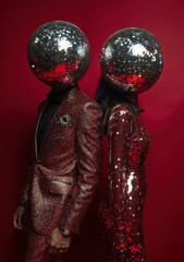 New Year Party Vibes: Disco Ball Heads and Glamorous Outfits