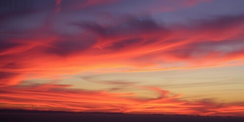 Fototapeta premium A stunning abstract sky at sunset with vibrant colors blending together in a mesmerizing display, breathtaking, nature