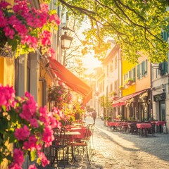 Fototapeta premium Charming street lined with flowers and outdoor dining in a sunny setting.
