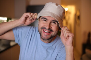 Handsome man wearing a bucket hat  © ajr_images