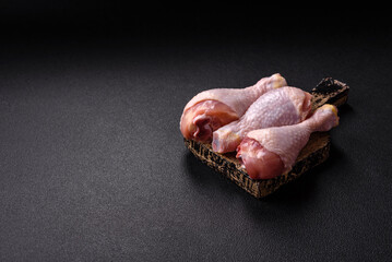 Raw chicken or turkey legs with salt, spices and herbs