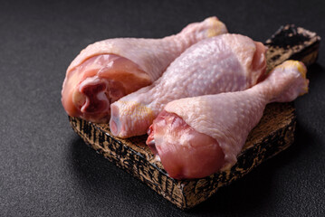 Raw chicken or turkey legs with salt, spices and herbs