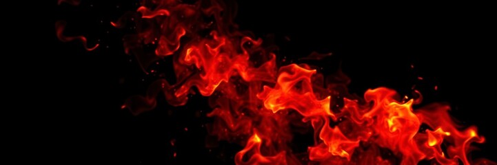 Fototapeta premium Abstract image of vibrant fire flames against a dark black background, energy, power