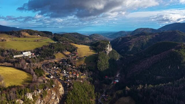 Drone footage of the Semmering railway in early December landscape, Austria, Europe. The landscape on former 20 schilling note bill.