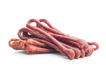 Smoked kabanos. Mini dried thin sausages isolated on white background