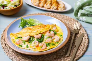 Prawn omelette with peas. Eggs with shrimps