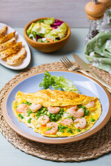 Prawn omelette with peas. Eggs with shrimps