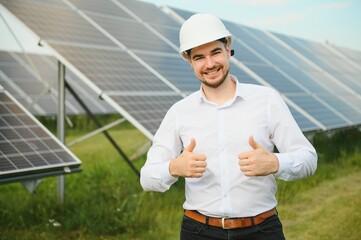 The solar farm, solar panel with engineer check the operation of the system, Alternative energy to...