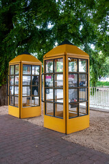 yellow public telephone box