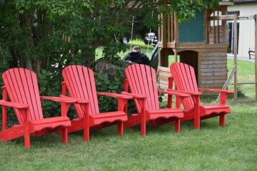 red wooden chairs in the park,