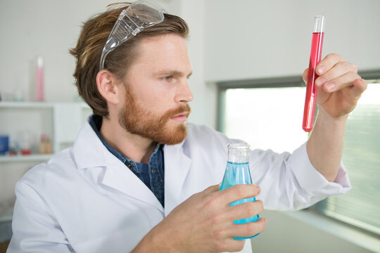 male medical researcher performing tests