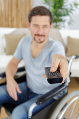 disabled man watching tv at home