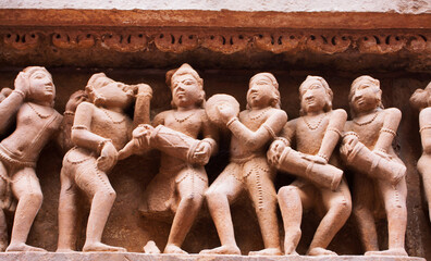 Stone artworks and sculptures of abandoned tample in Khajuraho, India. 