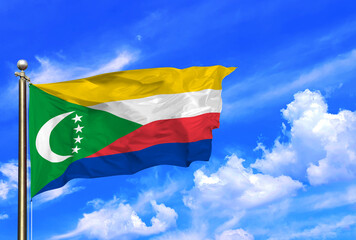 Comoros National Flag Waving Against a Bright Blue Sky