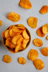 Homemade Flavored Paprika Potato Chips in a Bowl, top view. Flat lay, overhead, from above.