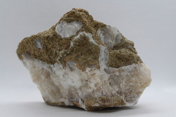 Calcite in a rock isolated on a white background 