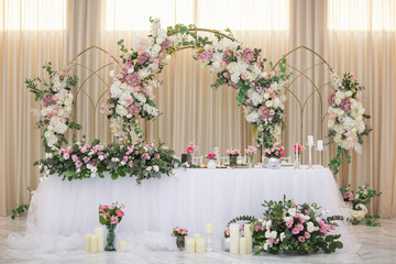 Restaurant wedding table for bride and groom. luxury wedding table with beautiful flowers. 
