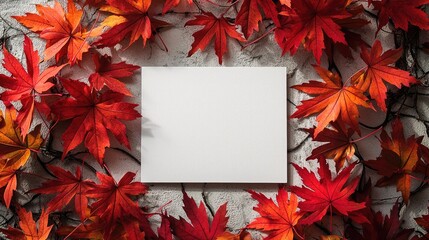 Obraz premium Blank Canvas Surrounded by Vibrant Red Autumn Leaves on Rustic Background for Seasonal and Creative Design Concepts